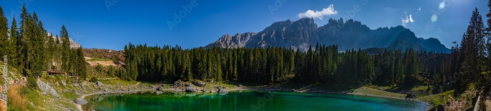 High resolution stitched panorama of a beautiful alpine view with the Latemar mountains at the famous Karersee, South Tyrol, Italy