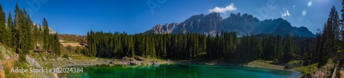 High resolution stitched panorama of a beautiful alpine view with the Latemar mountains at the famous Karersee, South Tyrol, Italy © Martin Erdniss