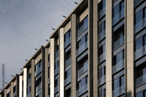 Close up view of modern, newly finished building with a metal - glass facade in Istanbul. © theendup