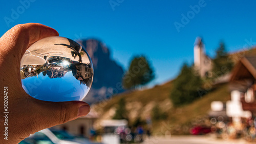 Crystal ball alpine landscape shot at the famous Grödner Joch, South Tyrol, Italy