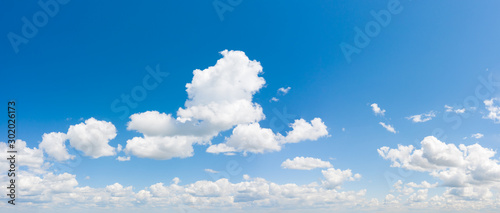 Fototapeta Naklejka Na Ścianę i Meble -  Panorama of blue sky with white cumulus clouds. Natural background
