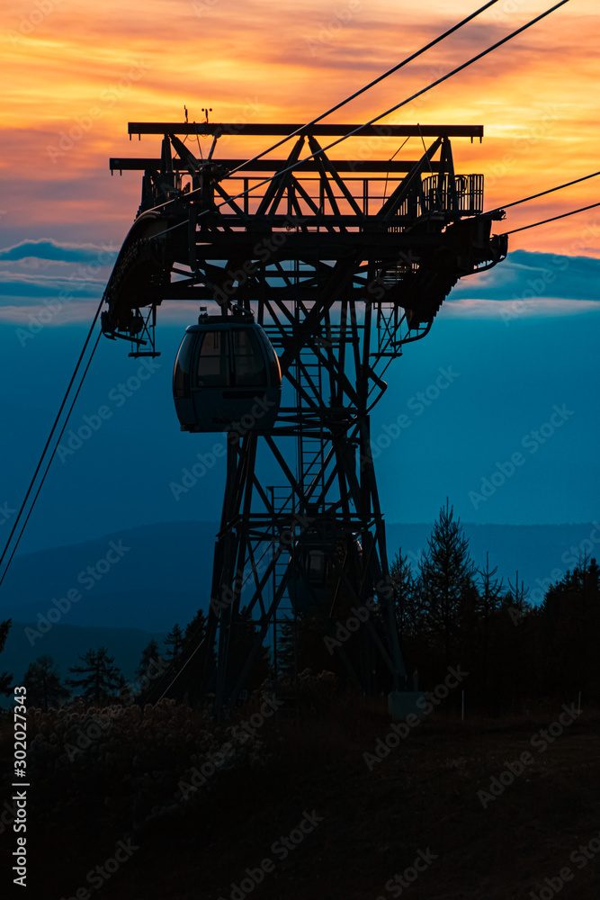 Beautiful alpine sunset view with a gondula tower at the famous Seiser Alm, South Tyrol, Italy