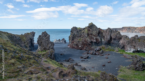 Volcanic lava rocks at Djupalonssandur beach in Snaefellsnes peninsula in Western Iceland photo
