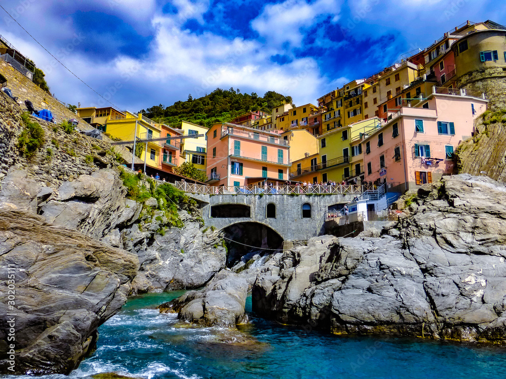  exploring the costal village of Monarola, which is a small village in the Liguria region of Italy known as Cinque Terra