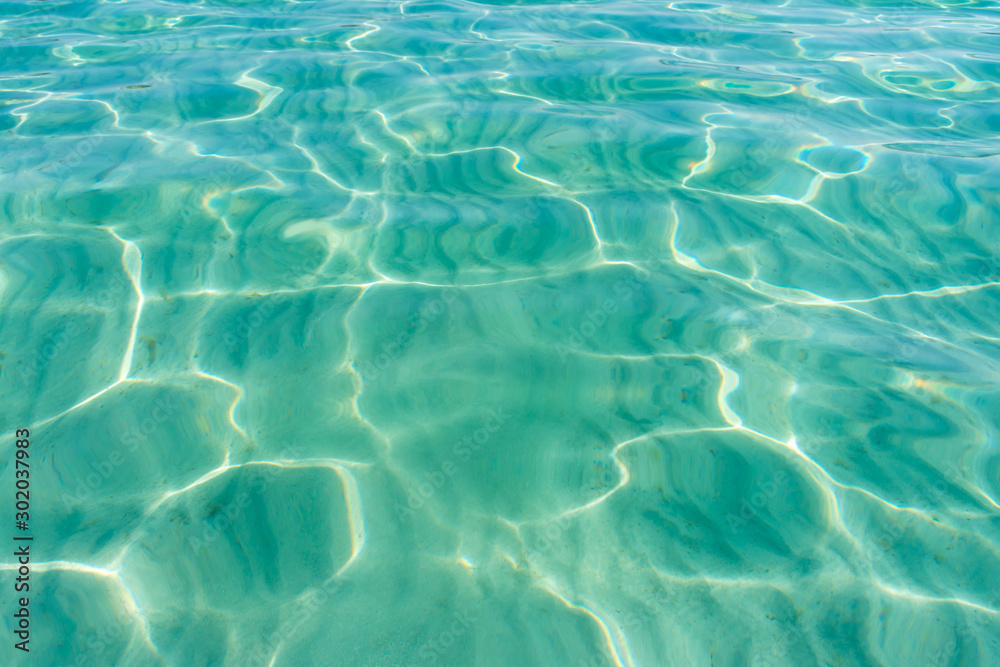 texture-sand and sunbeams on the bottom of the sea