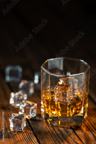 Fototapeta Naklejka Na Ścianę i Meble -  Whiskey in glass with ice