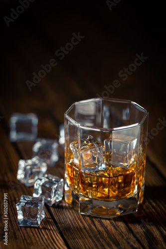 Whiskey in glass with ice