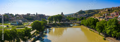 Virgin Mary Metekhi church with David the Builder statue in Tbilisi  Georgia. River Kura and old town on Sololaki hill.