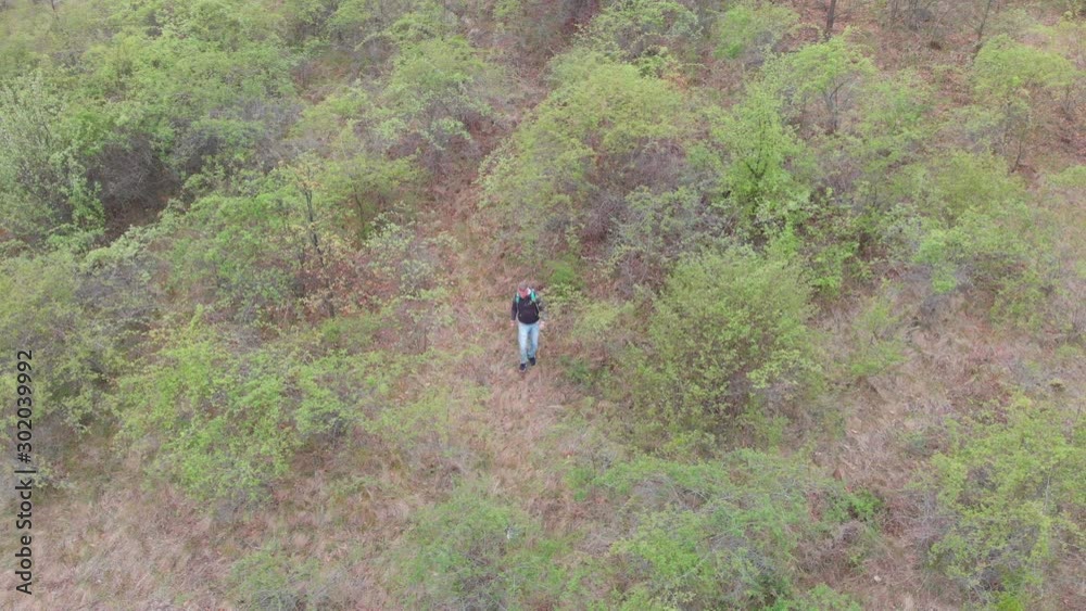 Hiking in green nature environment at springtime. Aerial view video. Hiking in green nature environment at springtime. Aerial view video.