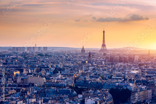 Panoramic aerial view of Paris  Eiffel Tower and La Defense business district. Aerial view of Paris at sunset. Panoramic view of Paris skyline with Eiffel Tower and La Defense. Paris  France.