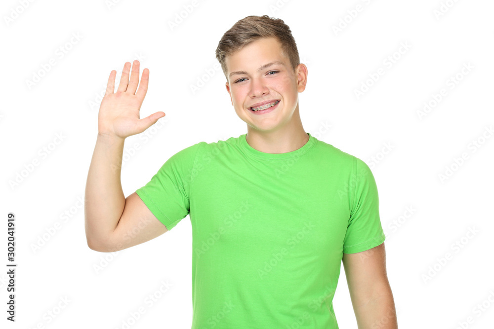 Young man with dental braces waving hand on white background Young man with dental braces waving hand on white background