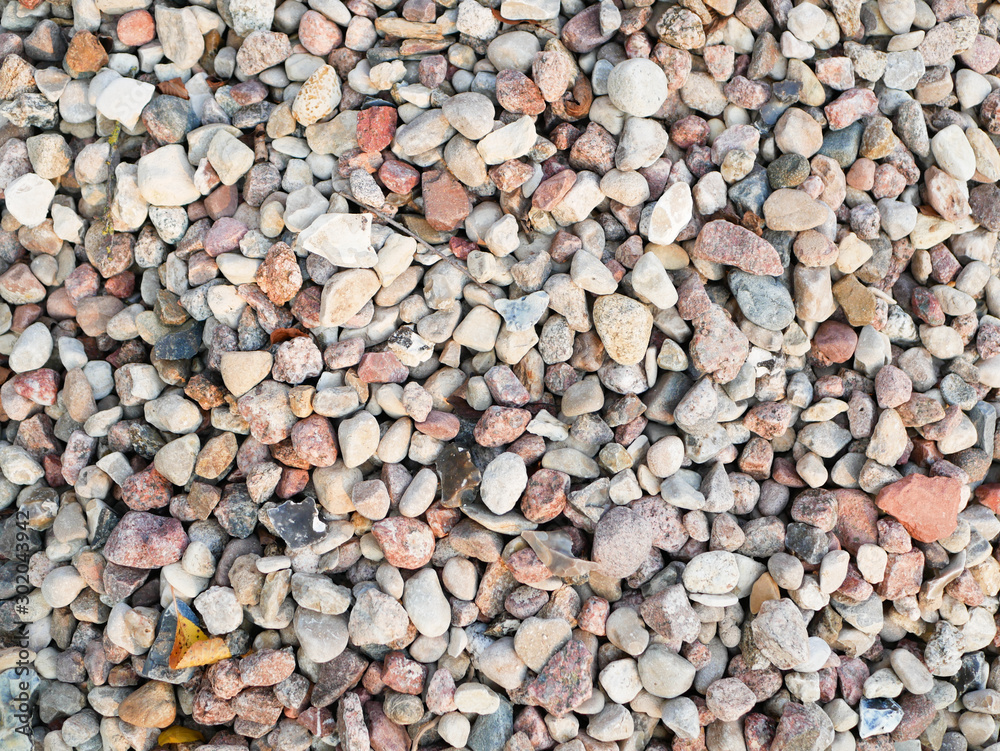 Pebbles closeup. High quality close up photo of various pebbles. On a sunny day. dry stone Pebbles closeup. High quality close up photo of various pebbles. On a sunny day. dry stone