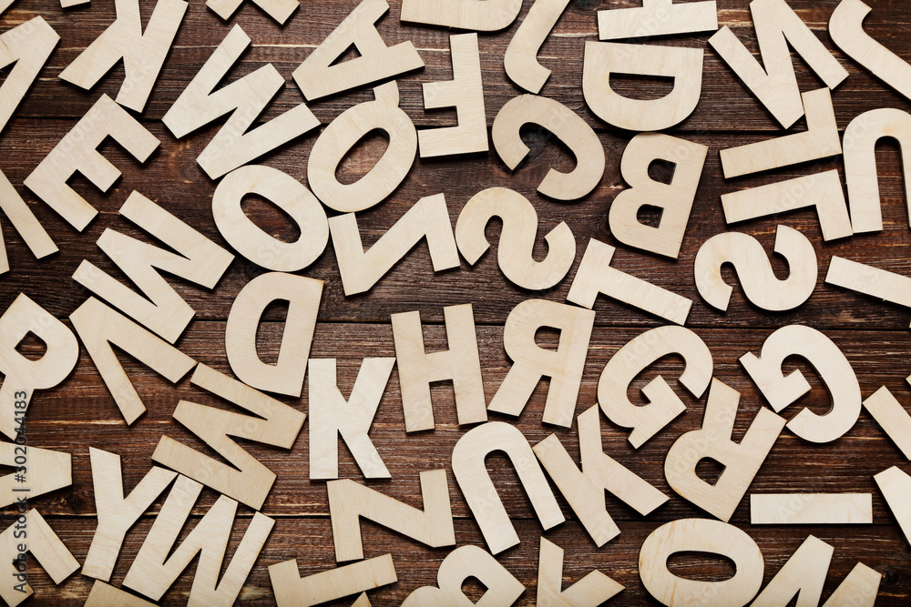 Wooden letters on brown table Wooden letters on brown table
