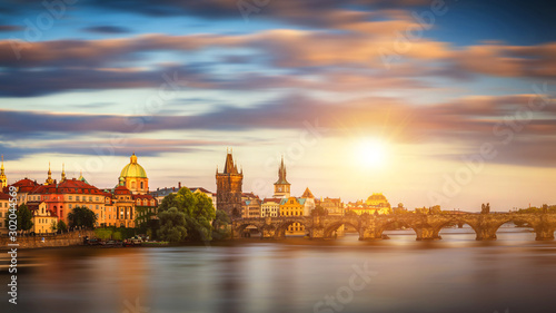 Charles Bridge (Karluv Most) and Lesser Town Tower, Prague in summer at sunset, Czech Republic