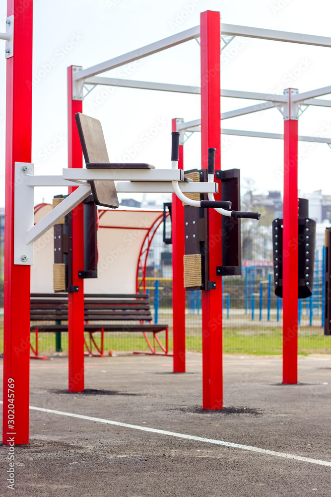 Healthy lifestyle concept. Colorful exercise machines on the street, which is being established as the new community health center. Healthy lifestyle concept. Colorful exercise machines on the street, which is being established as the new community health center.