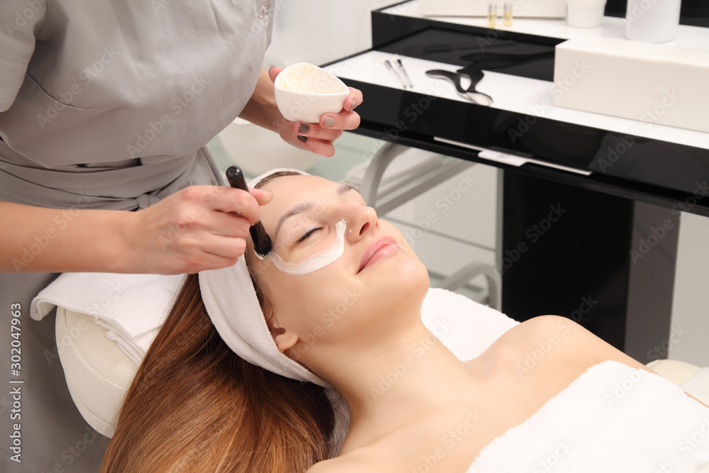 Woman having cosmetic facial seaweed treatment in spa. Woman having cosmetic facial seaweed treatment in spa.