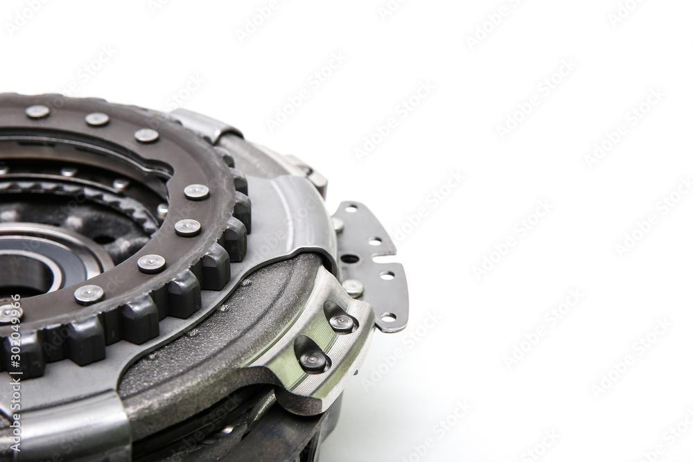 a part of car automatic transmission clutch basket. clutch with disk DSG on white background from the side a part of car automatic transmission clutch basket. clutch with disk DSG on white background from the side