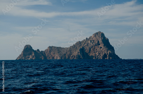 island of es vedra imposing rock massif seen from the sea