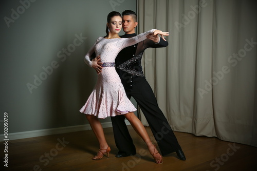 couple dancing Latin dances. man and woman show the movement of the dance Rumba