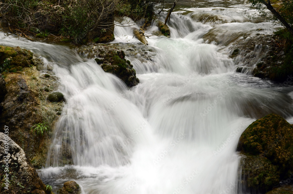 Fototapeta premium Water flow of the Canyon. Forest and mountain landscapes