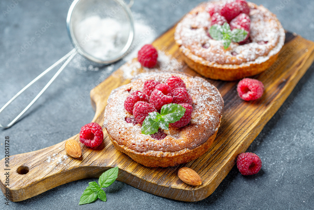 Delicious mini-tarts (tartlets) with raspberries.