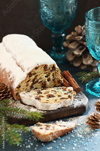 Stollen. Traditional German Christmas cake Stollen on wooden background.