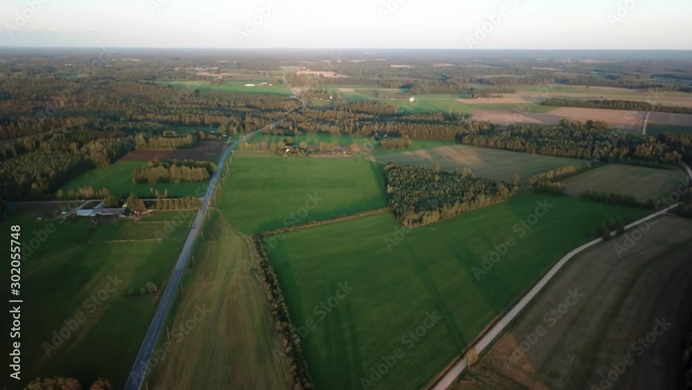 Flying away from the farms and roadways on this cold morning as the fall foliage has begun to turn. A slow steady aerial pull away shot from the farmlands in this rural community Flying away from the farms and roadways on this cold morning as the fall foliage has begun to turn. A slow steady aerial pull away shot from the farmlands in this rural community