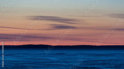Frozen lake at sunset time in late winter in Finland © Jani Katajisto