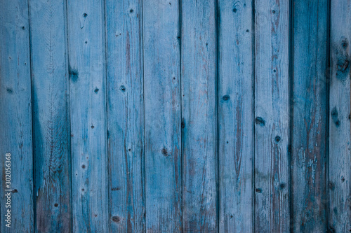 Old wooden boards with peeling paint. Old background. Textured planks of oak and pine. Bright colours. Natural aging of the material.