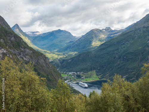 View on Geirangerfjord in Sunnmore region, Norway, one of the most beautiful fjords in the world, included on the UNESCO World Heritage. View from Ornesvingen eagle road viewpoint, early autumn