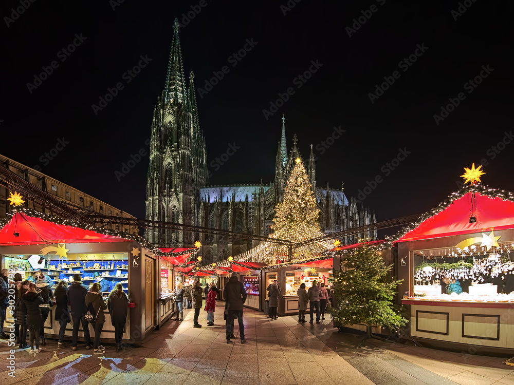 Cologne Cathedral Christmas Market in night, Germany. This is the most popular and best-known of all the city markets in front of the famous Cologne Cathedral.