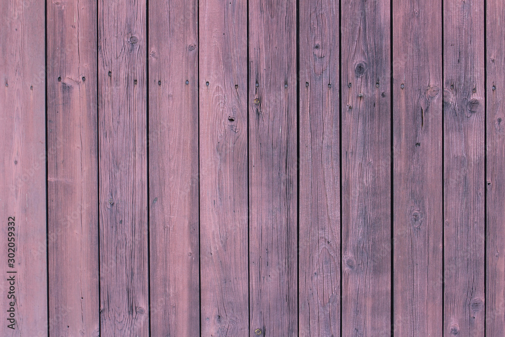 Fototapeta premium Wooden wall background in pink tone