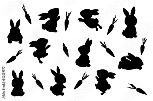 Cute little easter bunnies and carrots. Silhouettes on white background