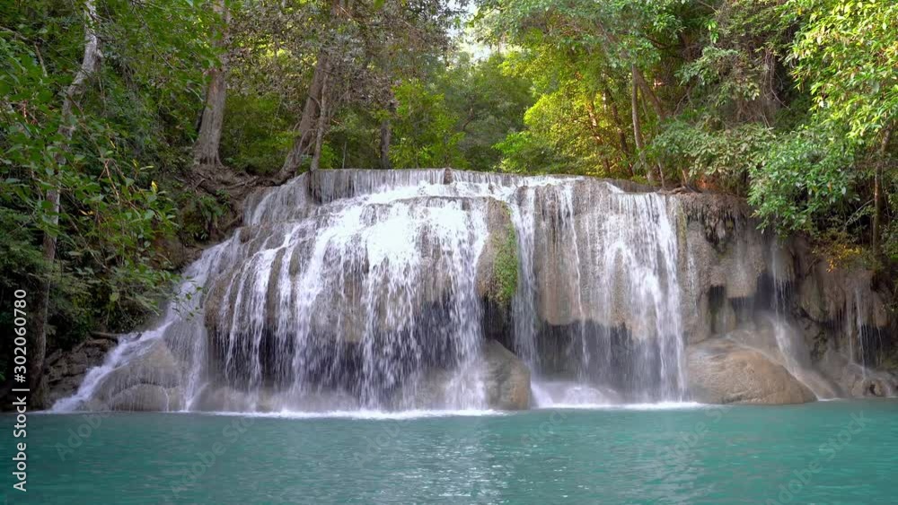 zoom out video of Erawan water fall (Second floor), tropical rainforest at Srinakarin Dam, Kanchanaburi, Thailand. Beautiful waterfall in Thailand. zoom out video of Erawan water fall (Second floor), tropical rainforest at Srinakarin Dam, Kanchanaburi, Thailand. Beautiful waterfall in Thailand.