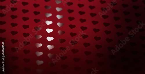 Fotografie A heart pattern of spot uv varnish print on red note paper background