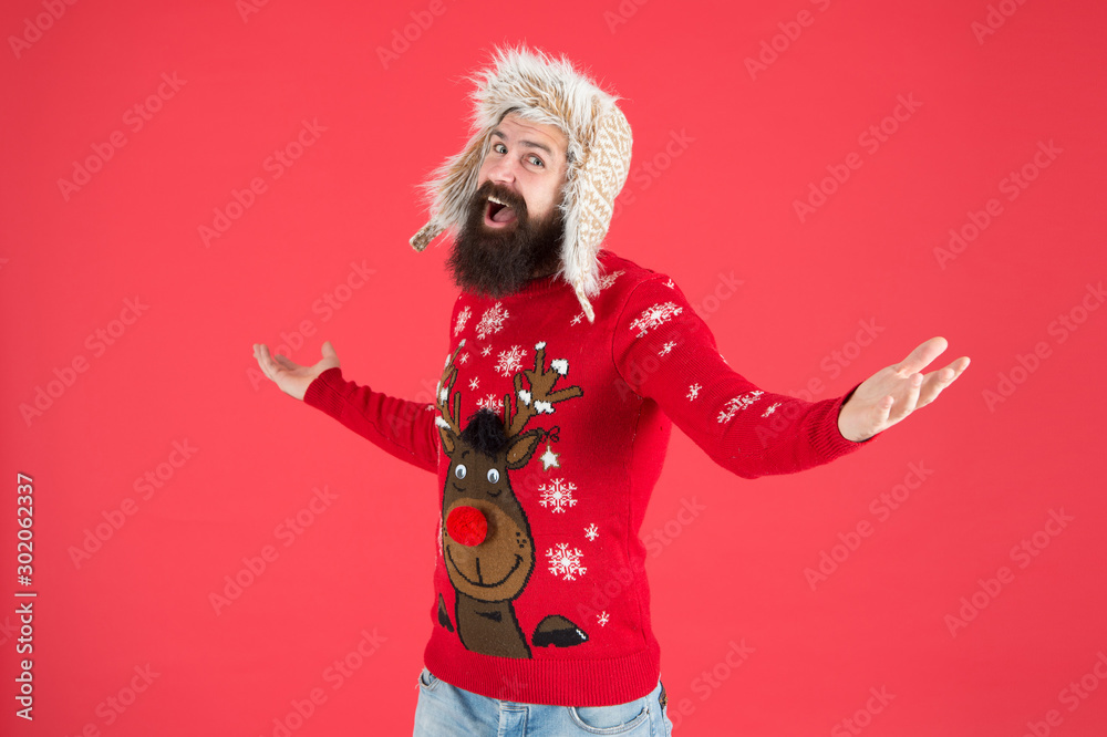 Happy new year. Join holiday party craze and host Ugly Christmas Sweater Party. Winter party outfit. Invitation ugly sweaters party. Sweater with deer. Hipster bearded man wear winter sweater and hat ...