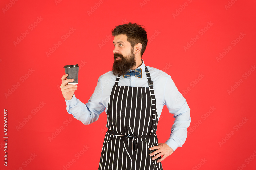 Experienced barista. mature man red background. skilled servant. barista hipster chef apron. elegant confident bartender. male drink coffee. bearded man hold take away coffee. brutal waiter in cafe Experienced barista. mature man red background. skilled servant. barista hipster chef apron. elegant confident bartender. male drink coffee. bearded man hold take away coffee. brutal waiter in cafe
