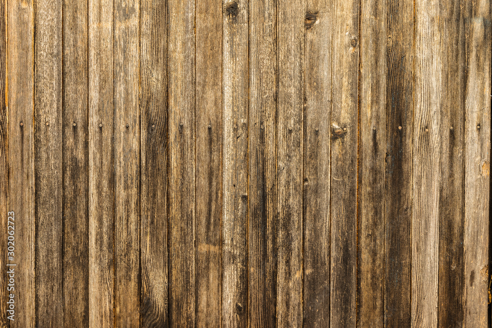 Fototapeta premium Old gloomy planks nailed with rusty nails