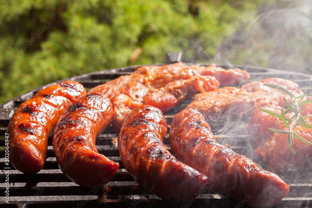 Fototapeta premium Grilling sausages.