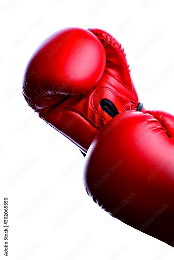 Pair of red boxing gloves isolated on a white background