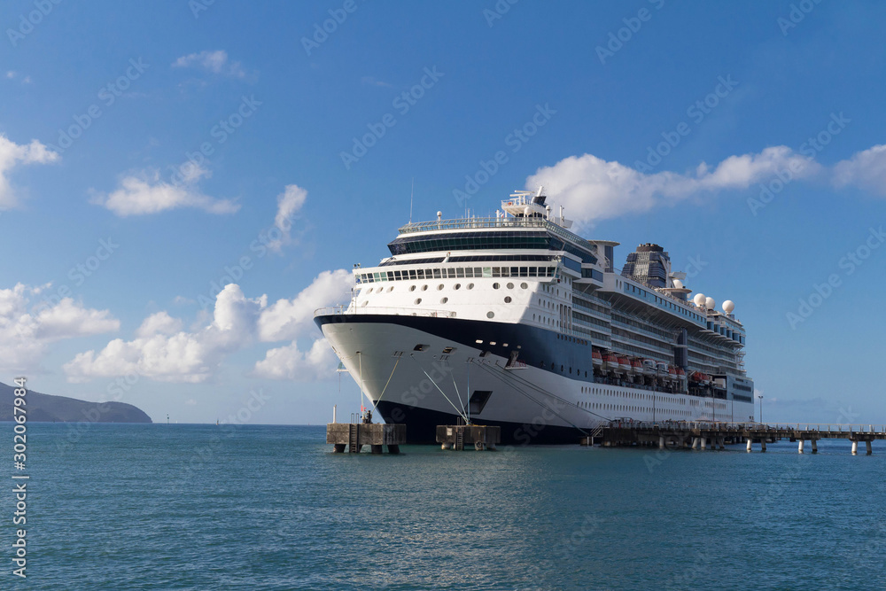 Large beautiful cruise ship at sea and nice cloudy sky on background - obrazy, fototapety, plakaty 
