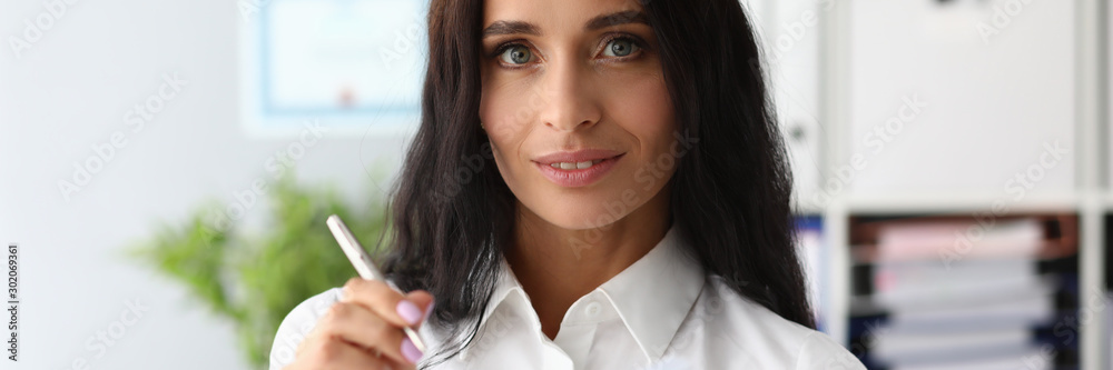 Success smiling businesswoman holding diary with Success smiling businesswoman holding diary with