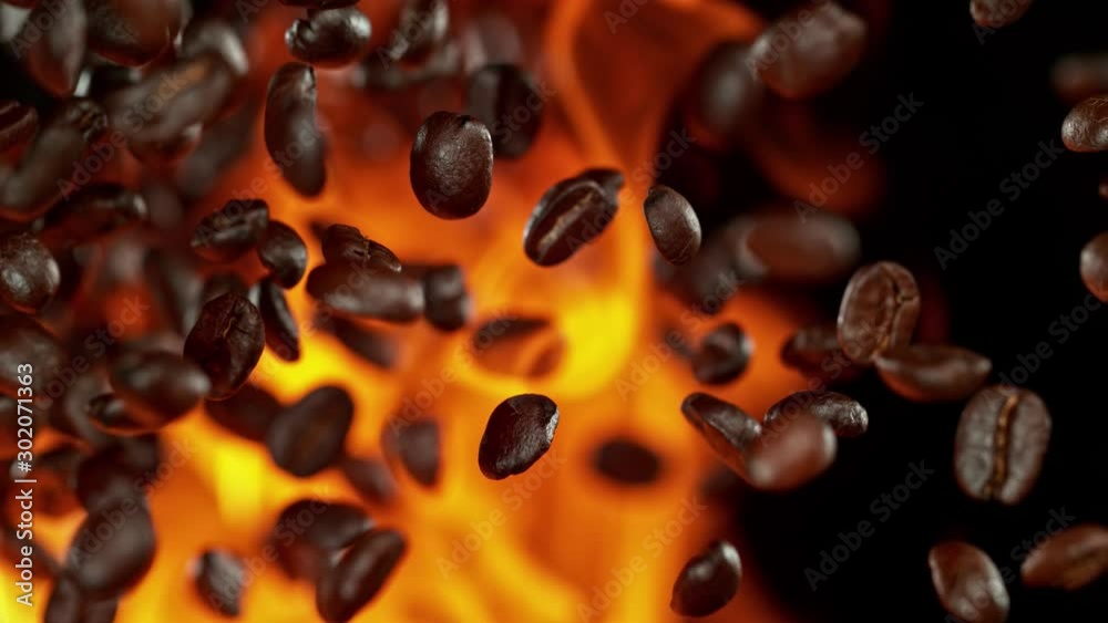 Super Slow Motion Shot of Flames and Coffee Beans Explosion on Black Background at 1000fps.