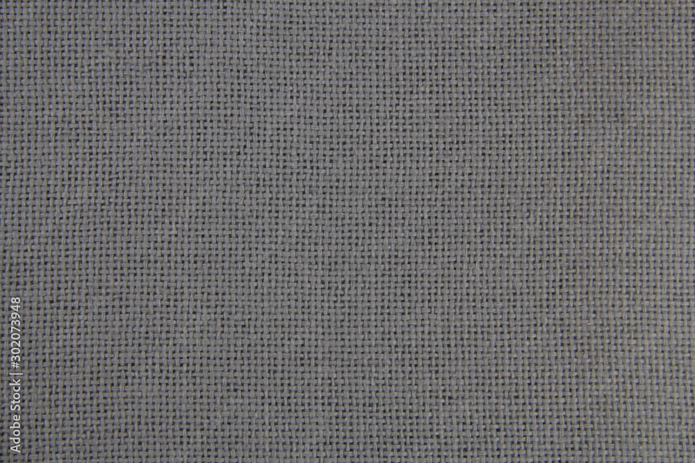 Fabric texture close-up. Grey cloth. Natural fabric. Fabric texture close-up. Grey cloth. Natural fabric.