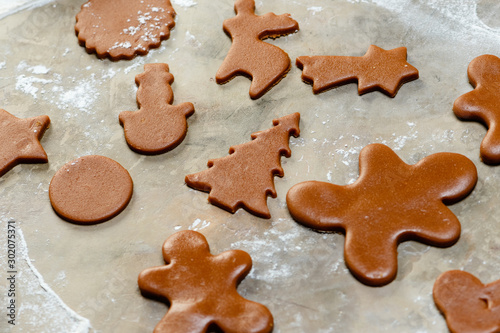 The process of making cookies and gingerbread at home. Raw christmas cookies view from above. Homemade bakery making