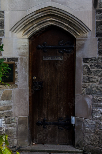 wooden door in stone archway