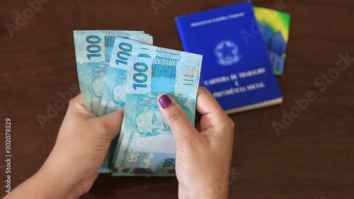 female hand counting Real banknotes photo