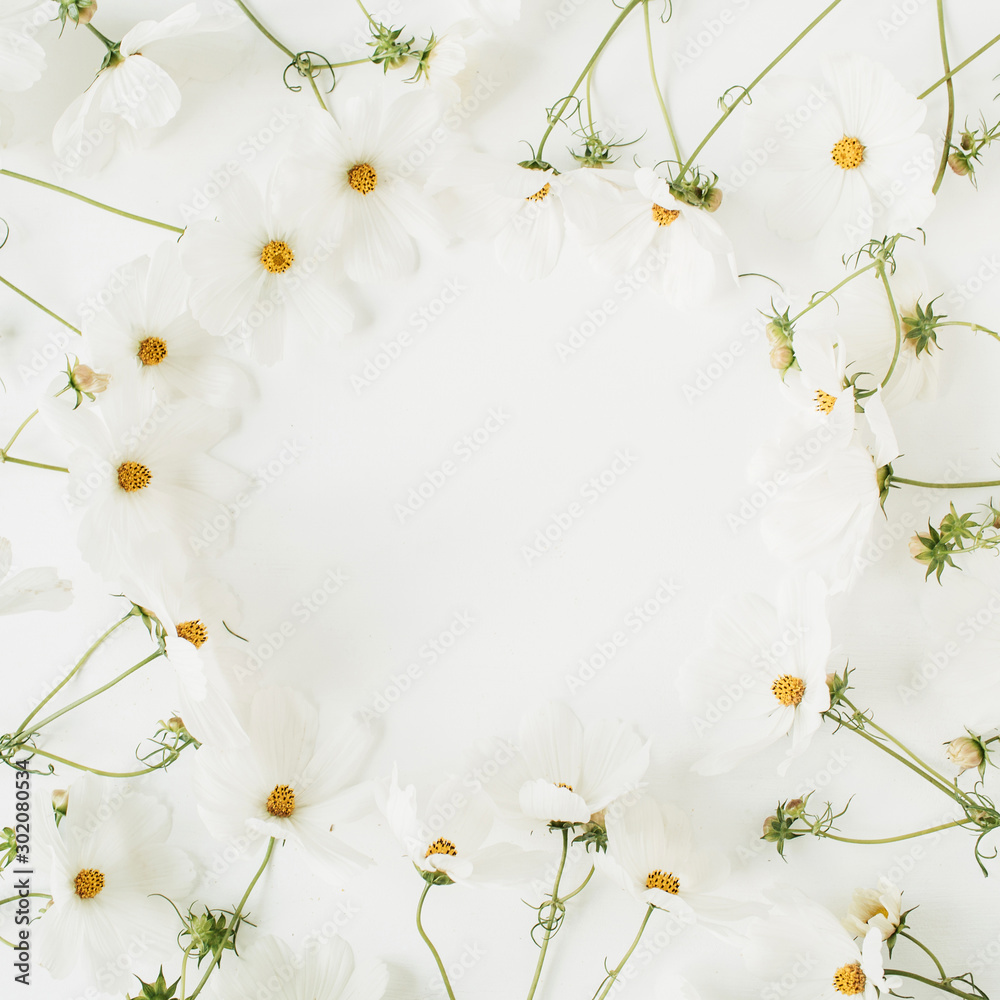 Minimal styled concept. Wreath made of white daisy chamomile flowers on white background. Creative lifestyle, summer, spring concept. Copy space, flat lay, top view.