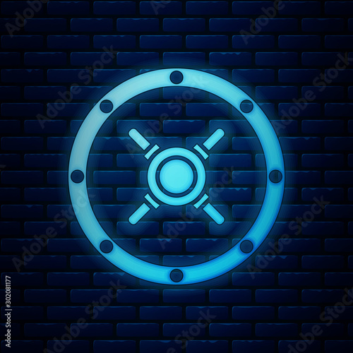 Glowing neon Safe icon isolated on brick wall background. The door safe a bank vault with a combination lock. Reliable Data Protection. Vector Illustration