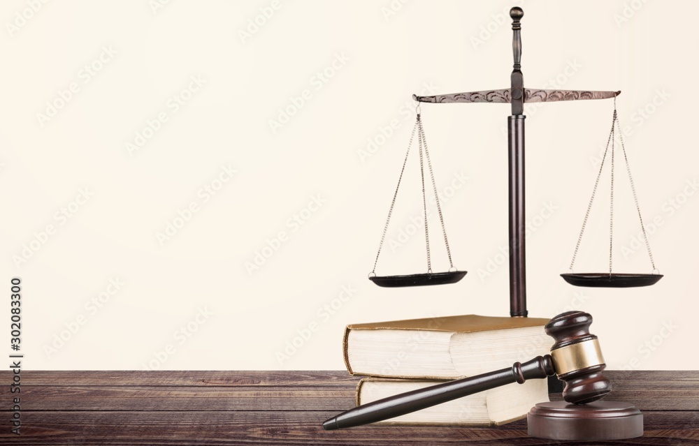 Justice Scales and books and wooden gavel on table. Justice concept Justice Scales and books and wooden gavel on table. Justice concept